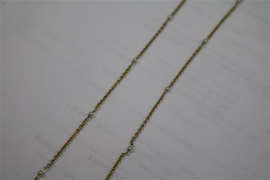 An 18ct gold and cultured? pearl drop necklace, the chain set with seed pearls, 62cm.